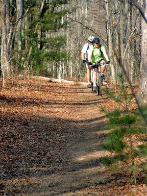 Riders on Hardtimes Connector trail.